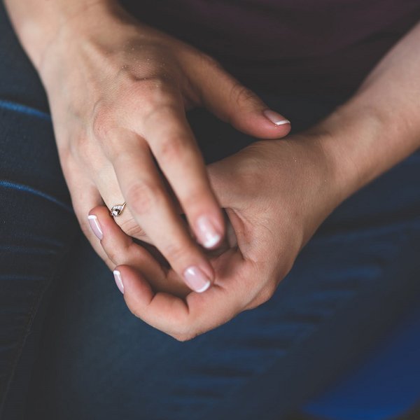 man rubbing his fingers